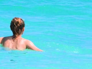 Smoothest nudist play in the warm water  at a nudist beach